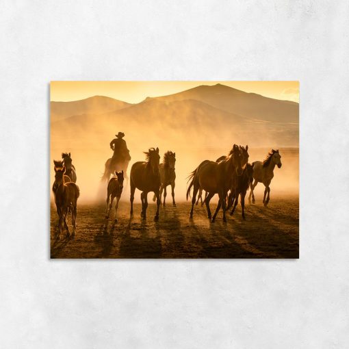 Obraz stado koni i kowboj